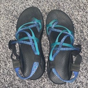 blue and green patterned chacos